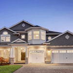 Grey single family home exterior in evening